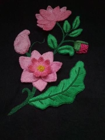 Spray of pink flowers and green leaves