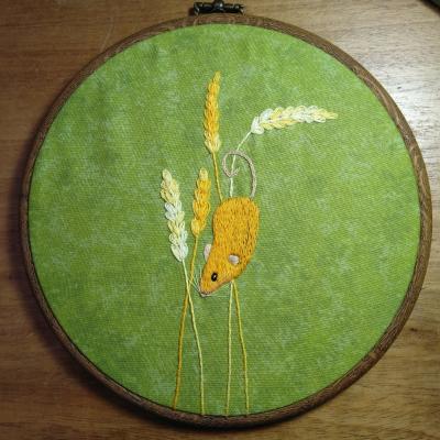 Harvest Mouse Dangling from Wheat Stalks