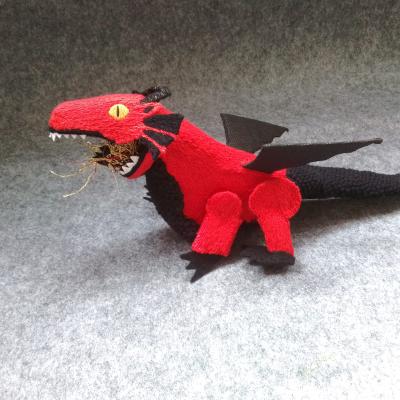 A red dragon with yellow eyes, white teeth and black wings, tail, chest and claws, is walking and breathing fire